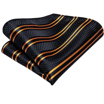 Czarno-złoty krawat w paski w kropki