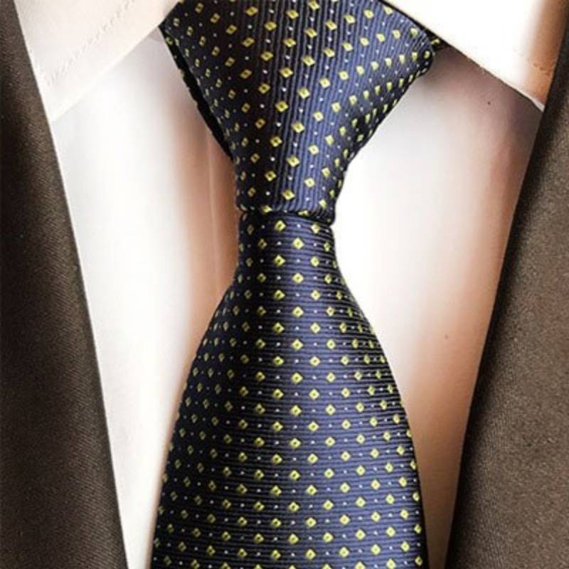 Granatowy krawat w żółto-białe kropki