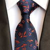 Granatowy krawat w pomarańczowe wzory