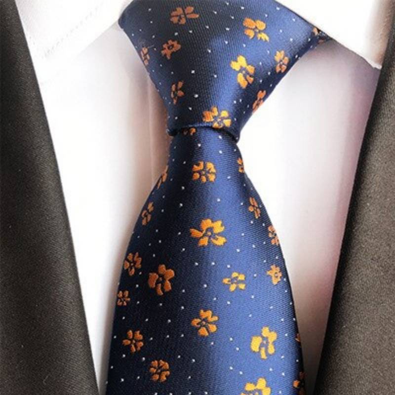 Niebieski krawat w pomarańczowe kwiaty i białe kropki