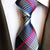 Niebieski krawat w różowe i beżowe paski