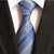 Szary krawat w niebieskie i błękitne paski