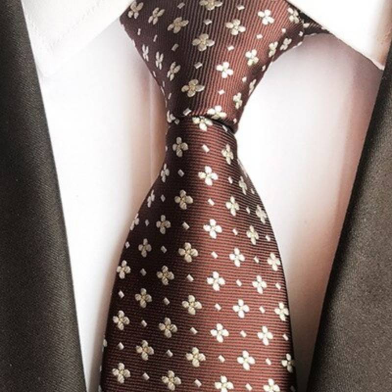 Brązowy krawat w żółte kwiaty i białe kropki