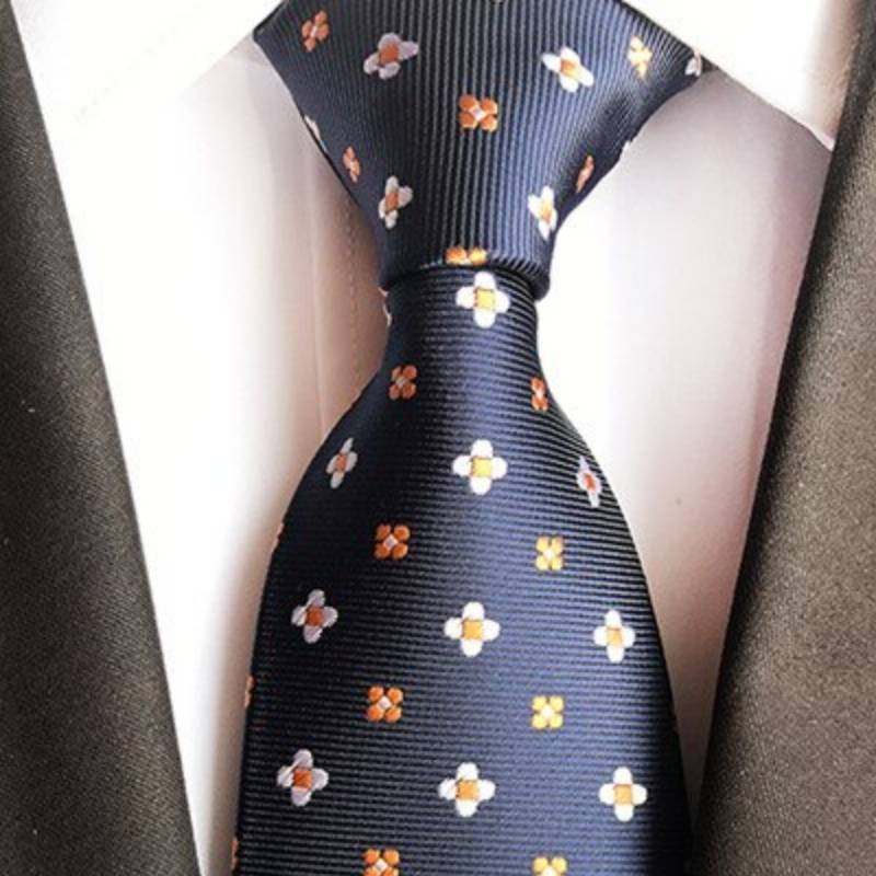 Czarny krawat w białe i pomarańczowe kwiaty