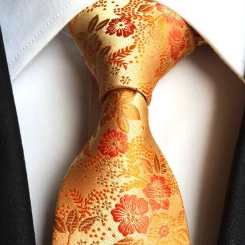 Kwiecisty pomarańczowy krawat