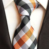 Krawat w białe, pomarańczowe i czarne paski
