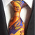Krawat w pomarańczowo-niebieskie paski we wzory paisley