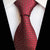 Ciemnoczerwony krawat w szachownicę i małe białe kropki
