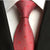 Krawat w czerwono-białe kropki i czerwony wzór