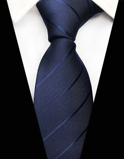 Granatowy krawat w paski