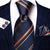 Krawat w ciemnoniebieskie i pomarańczowe paski