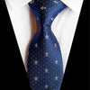 Granatowy krawat w niebieskie kropki i biały wzór