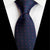 Granatowy krawat w czerwone i fioletowe kropki